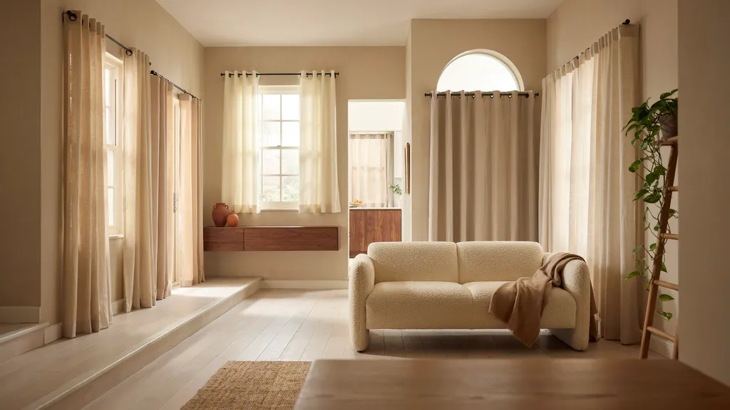 Different curtain hanging styles displayed across multiple windows in a modern home interior showing various fabric and rod designs.