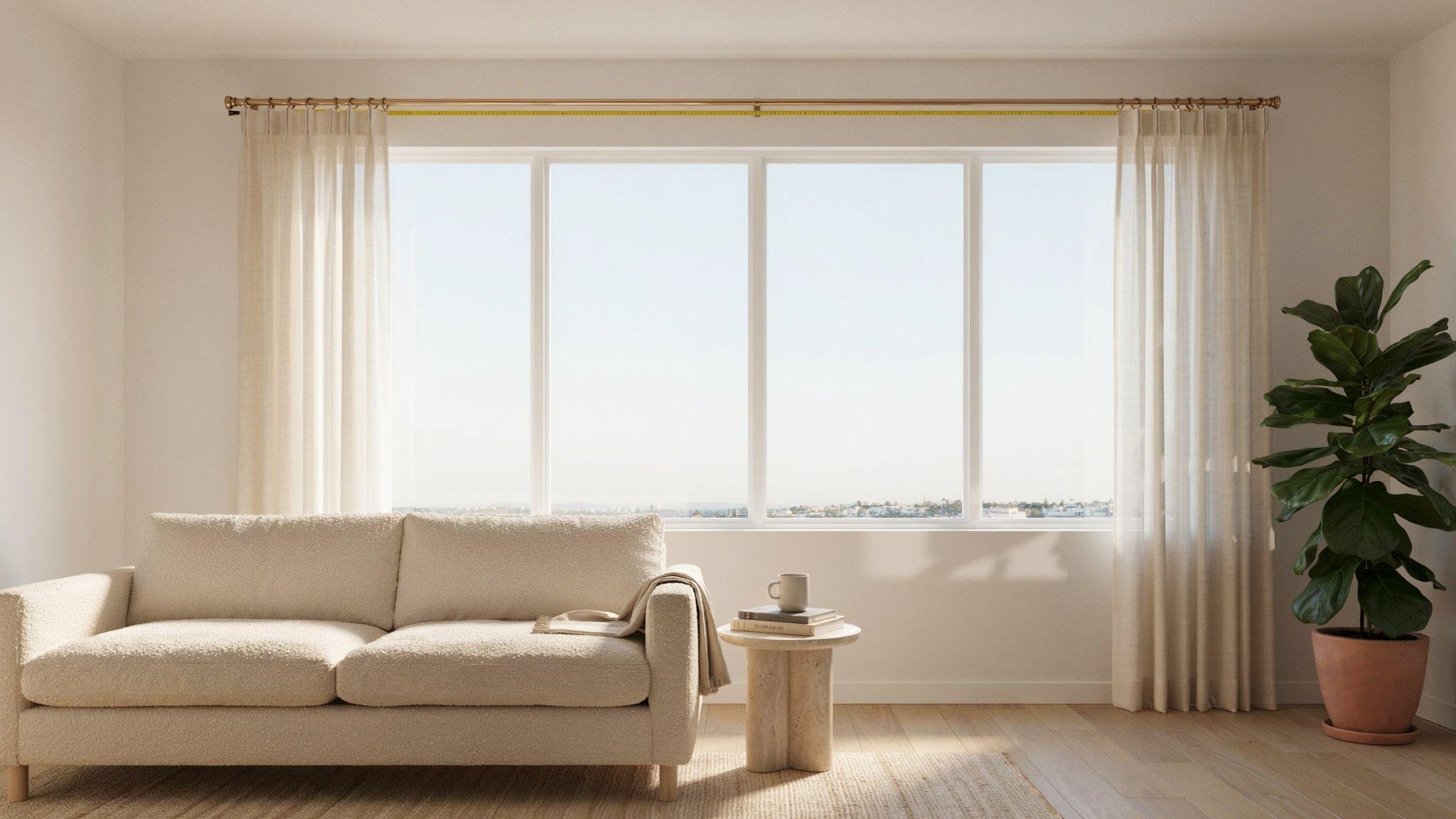 Measuring curtain rod width above window with tape in bright minimalist home interior design scene