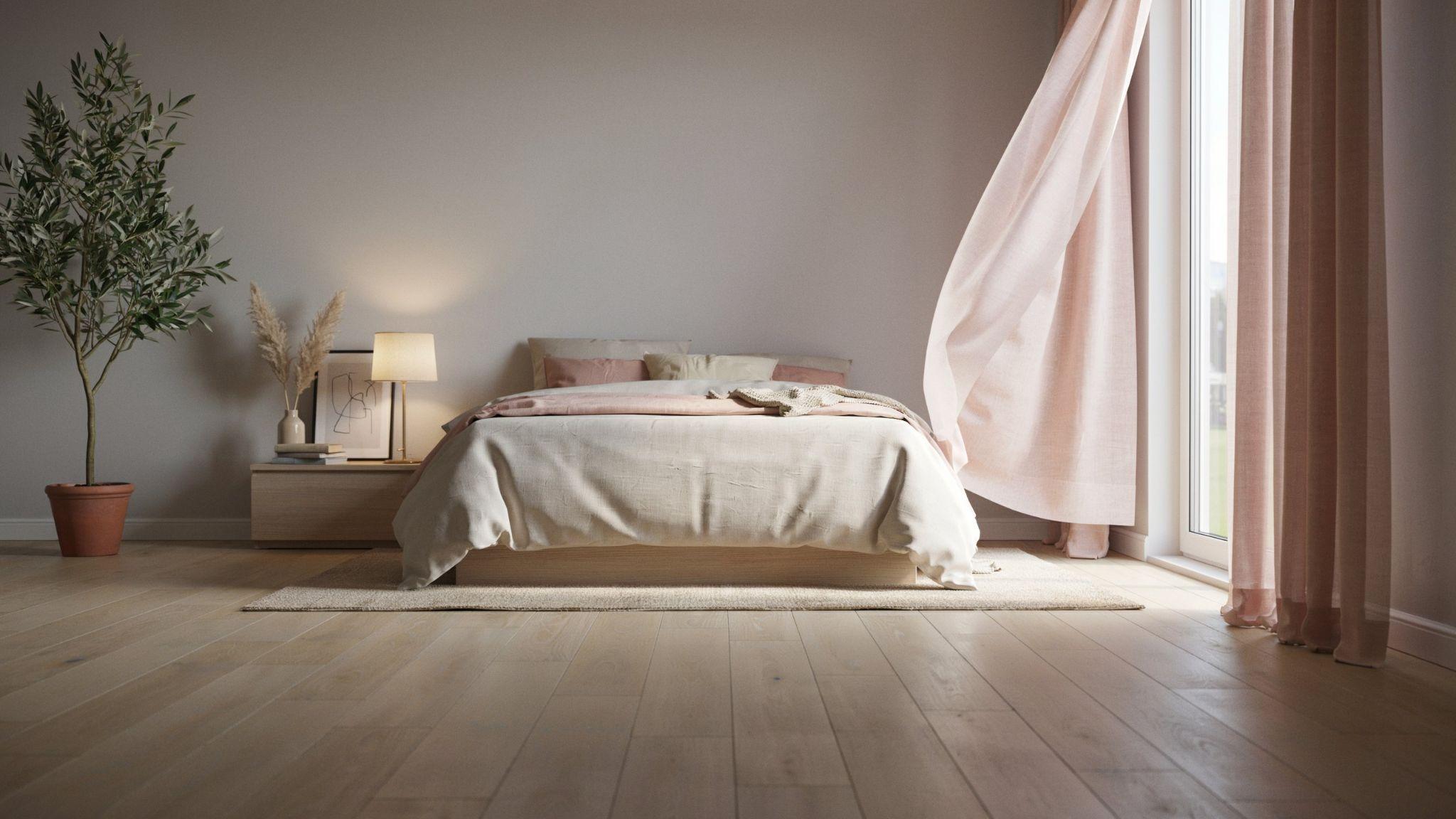 "Soft modern gray bedroom with blush pink curtains creating a warm romantic and cozy atmosphere"
