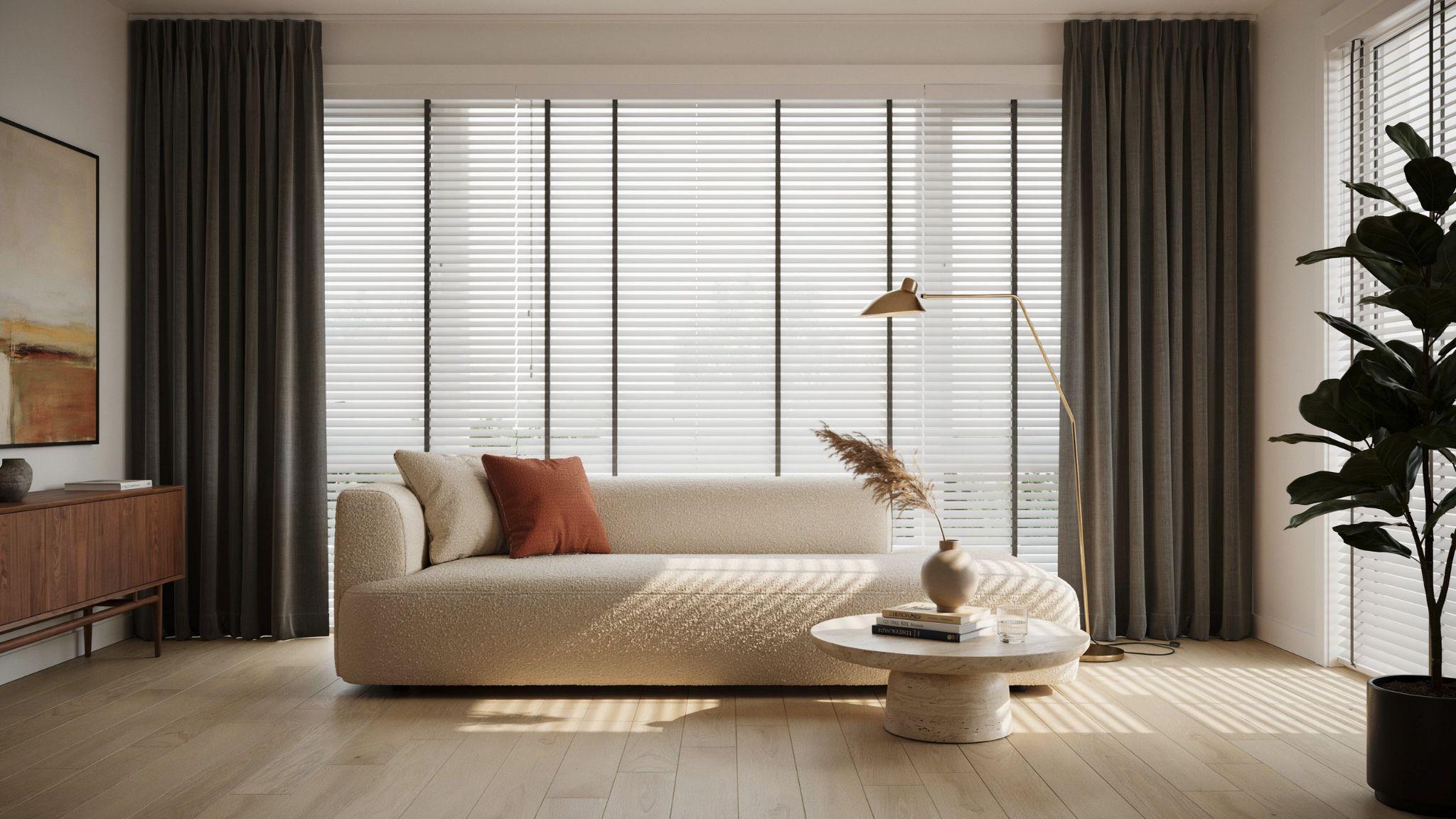 Dark curtains framing white blinds in a modern room.