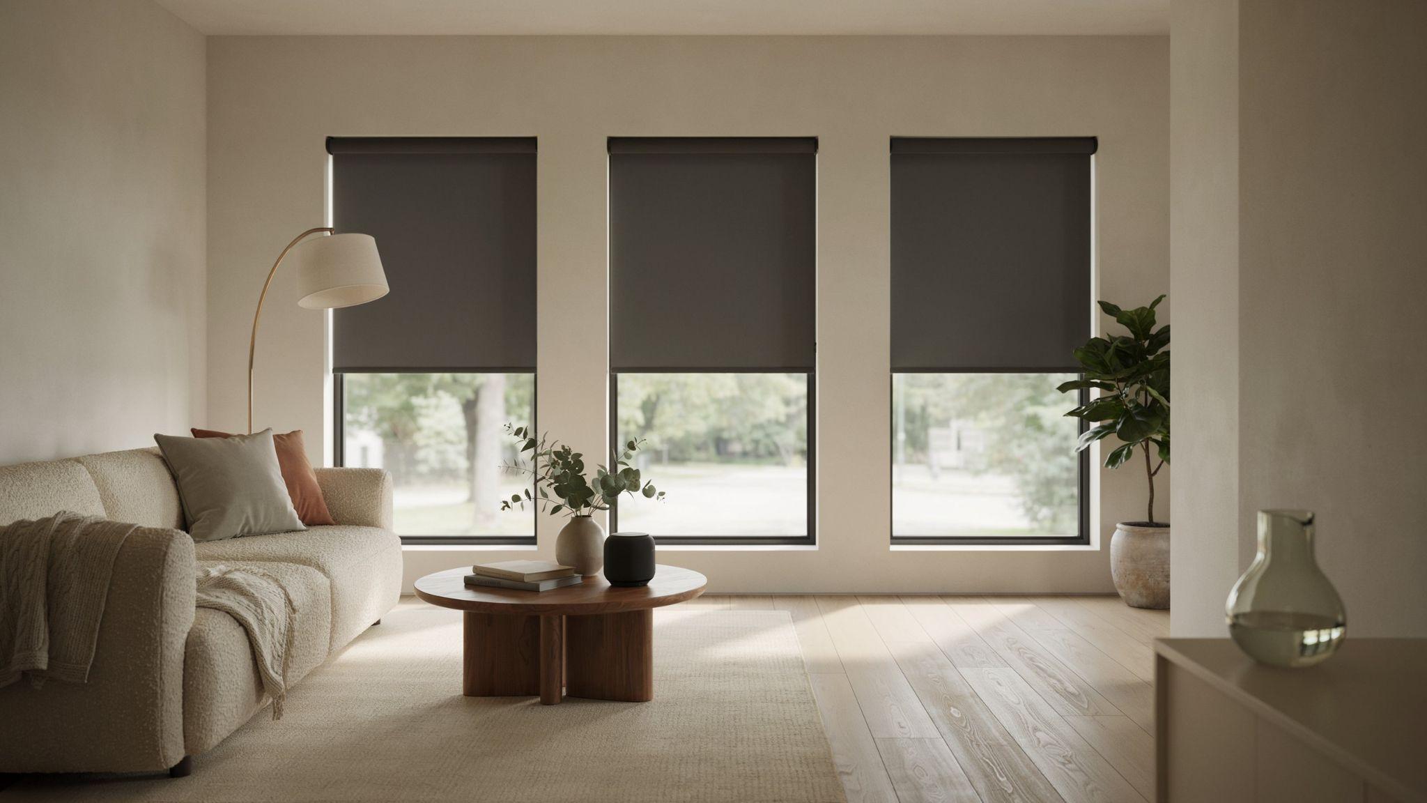Motorized smart blinds operating together across three modern windows.