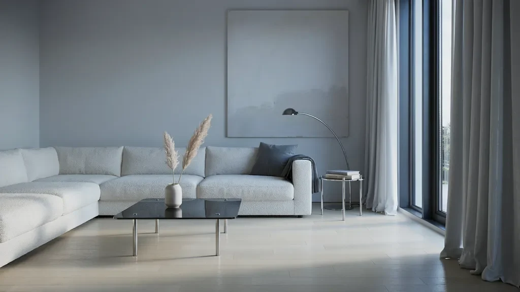 "Minimalist gray living room with silver curtains creating a sleek modern and cool-toned interior"