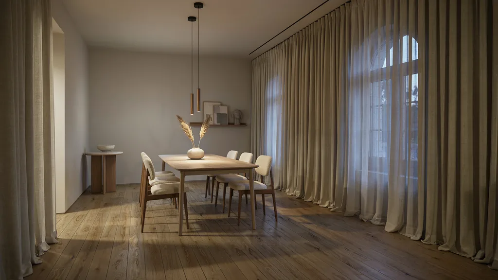 dining room with long puddled curtains creating elegant formal atmosphere in warm modern interior design.