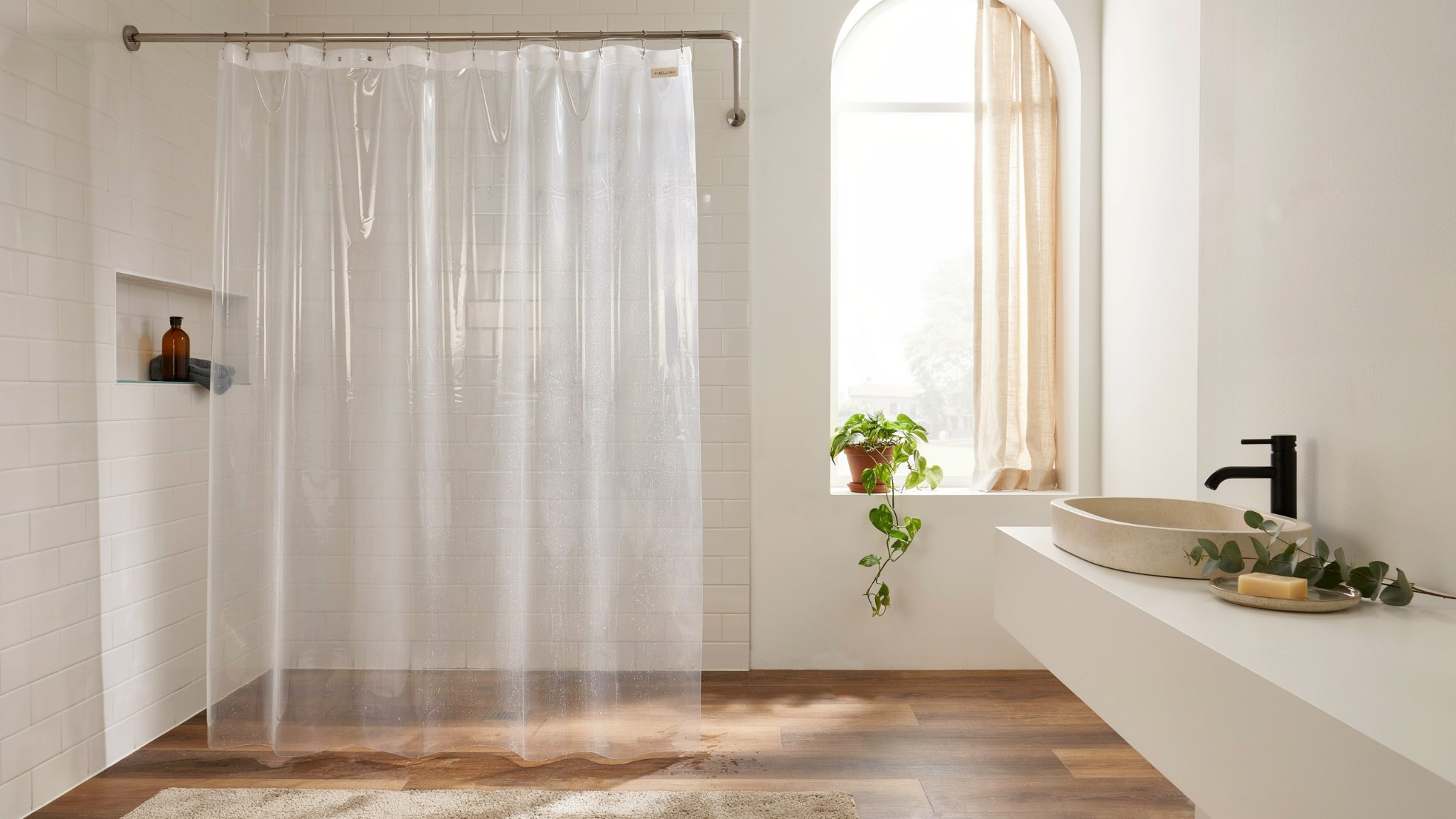 bathroom with PEVA shower curtain showing water resistance mold protection and lightweight easy use design in clean modern setting.