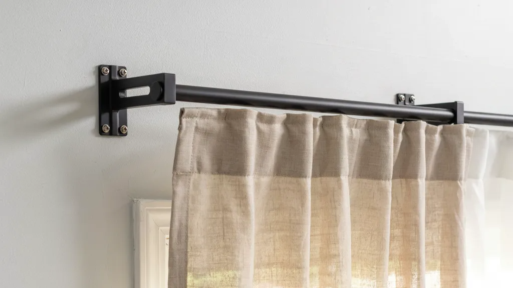 Securely installed curtain rod brackets supporting heavy curtains.