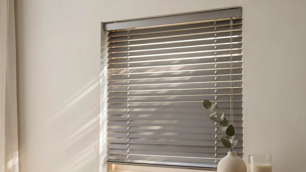 Close-up of Venetian blinds showing horizontal slats that can tilt to control light and privacy.