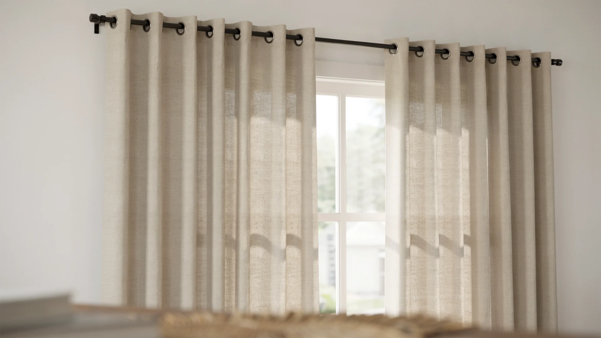 "Close-up of grommet curtains with metal eyelets on curtain rod showing even folds and natural light in modern interior window"