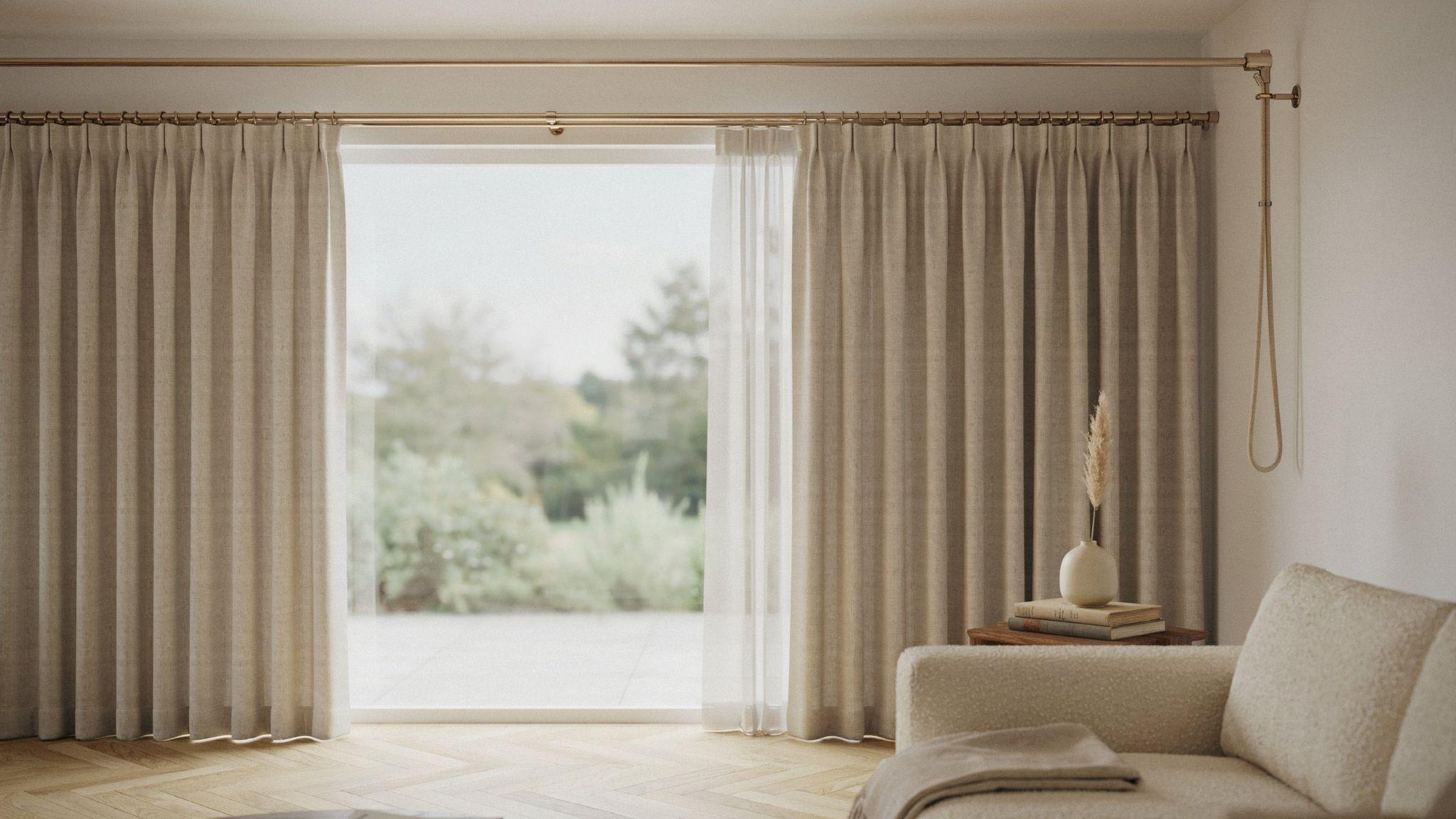 Cord-operated traverse curtains sliding smoothly across a window on a track system