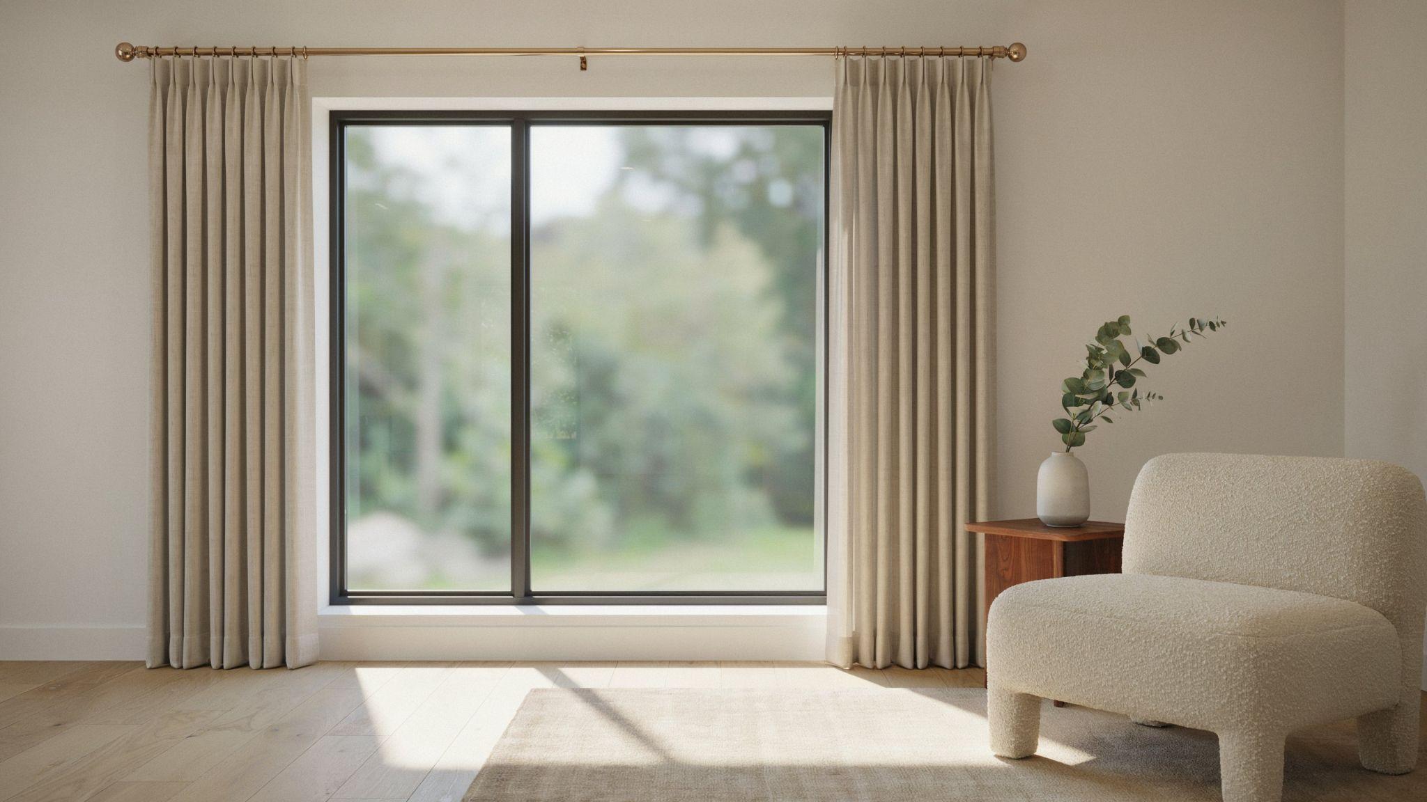 Curtain rod extending beyond window frame for better light and coverage.