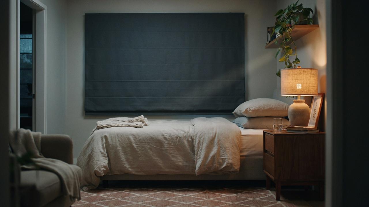 Blackout Roman shades in a bedroom.