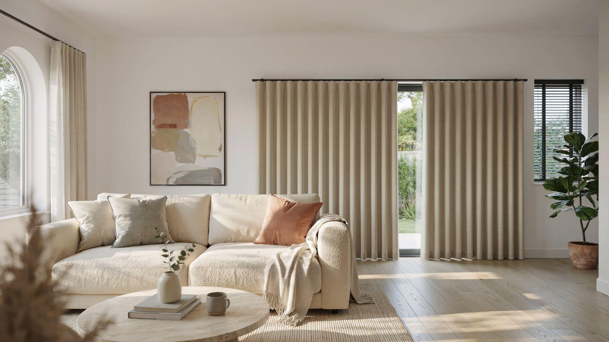 Contemporary living room with modern fabric vertical blinds on large windows offering stylish and practical coverage.