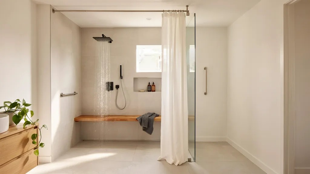Accessible walk-in shower with an easy-glide curtain system and barrier-free design.