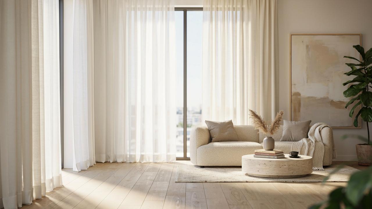 Modern living room comparing transparent sheer curtains and light-filtering semi-sheer curtains on adjacent windows.