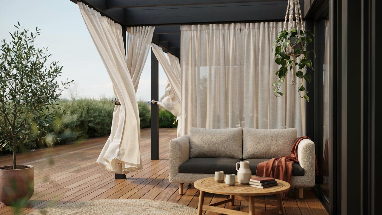 Outdoor curtains secured with weights and tiebacks to prevent them from blowing in the wind.