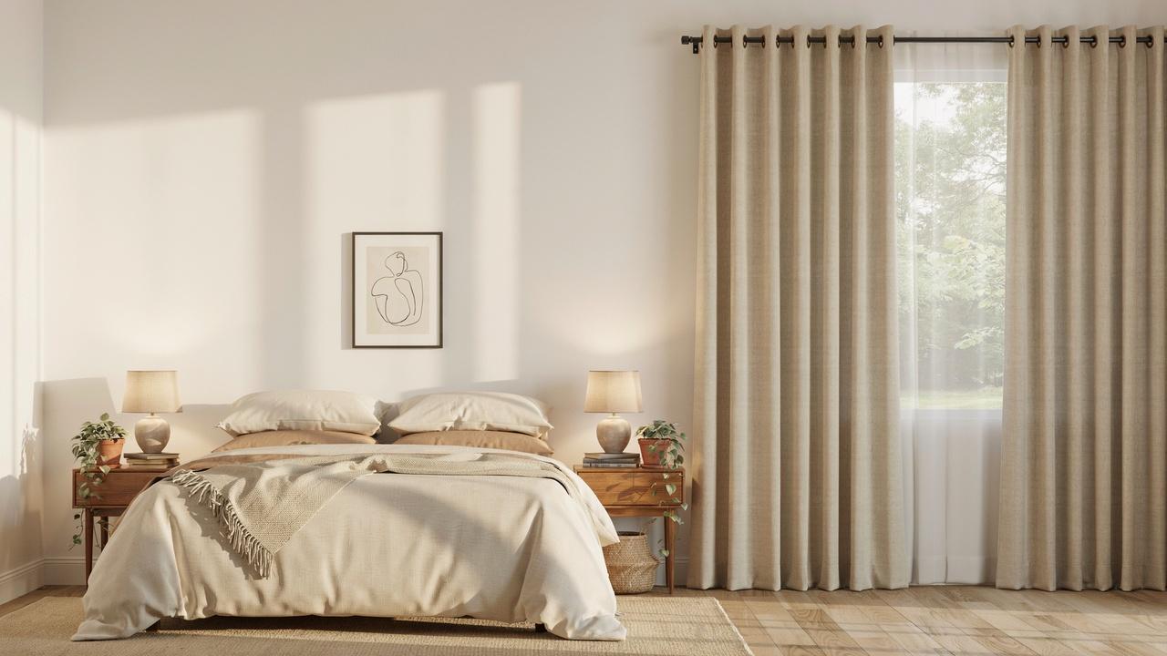 Cozy bedroom featuring classy grommet curtains that provide privacy and a comfortable, relaxing atmosphere.