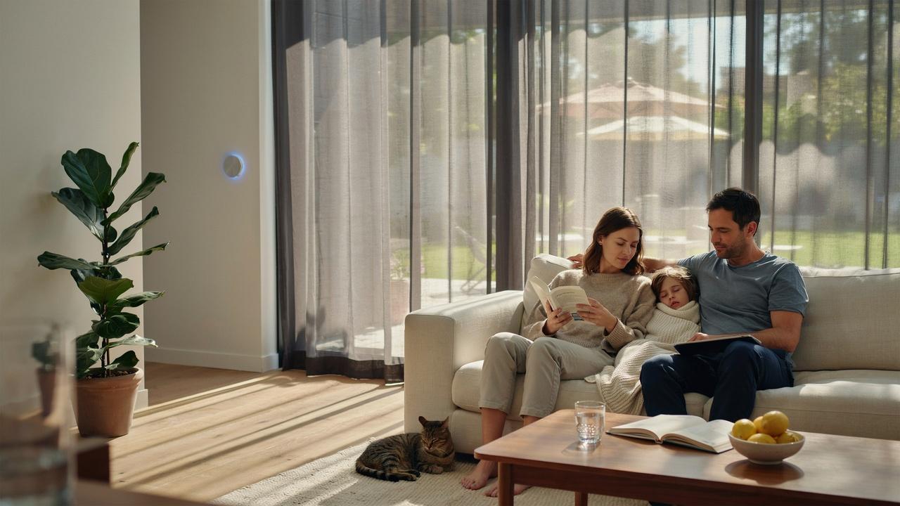 Modern home interior staying cool and comfortable with filtered sunlight after installing solar screens.