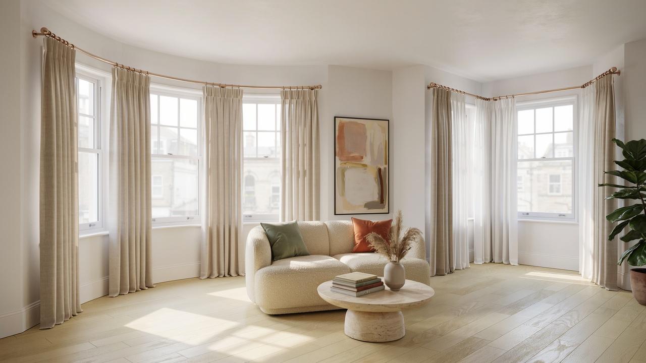 Bay and corner windows with custom-fitted curtain rods and elegant curtains demonstrating tailored placement solutions.
