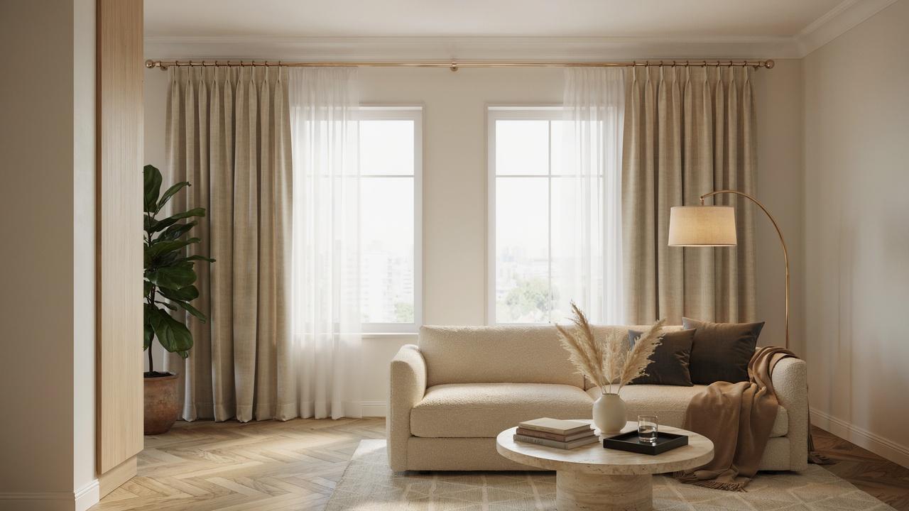 Stylish living room showing how properly placed curtain rods and floor-length curtains improve window design and make the space feel larger.