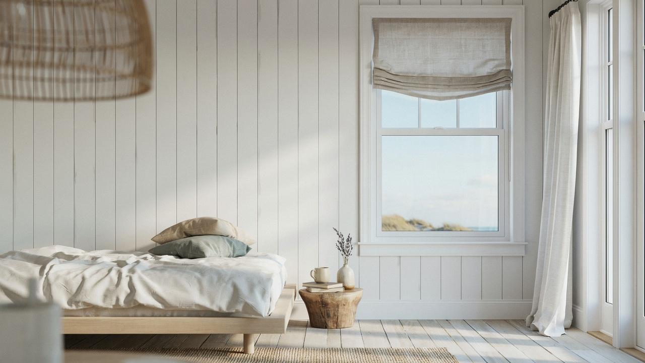 Relaxed Roman shade with curved bottom edge.