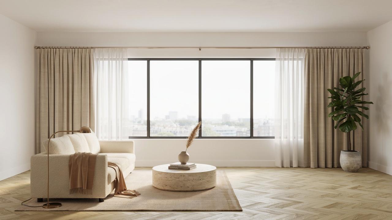 Large window with evenly balanced floor-length curtains and a properly sized curtain rod creating a harmonious, proportional look.