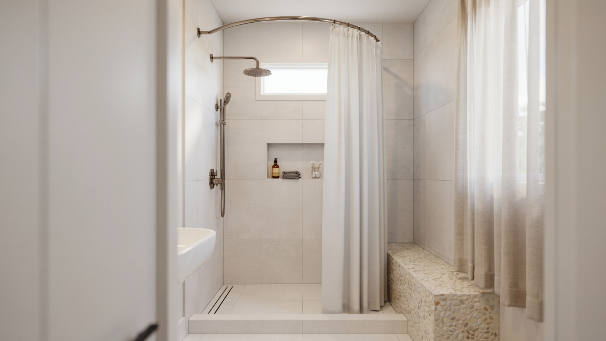 Walk-in shower featuring a curved curtain rod that creates additional space inside the shower area.