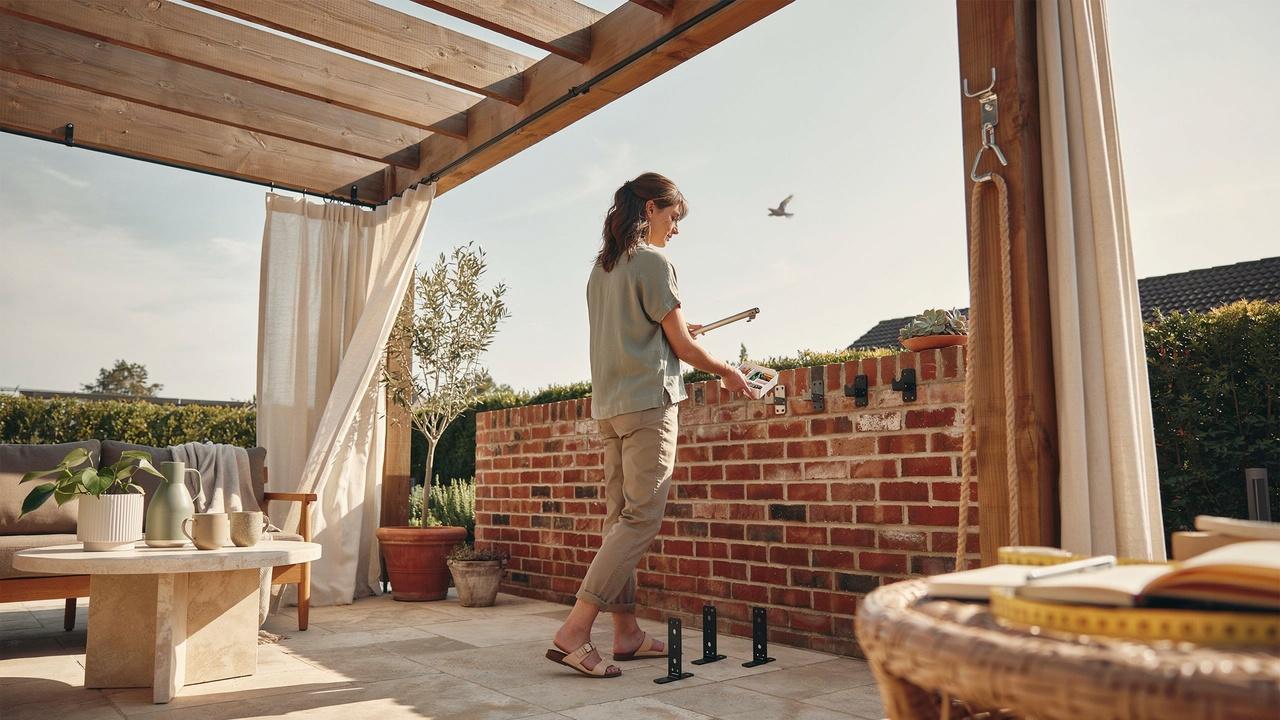 Different curtain hanging methods and hardware options for installing outdoor curtains on various wall surfaces.
