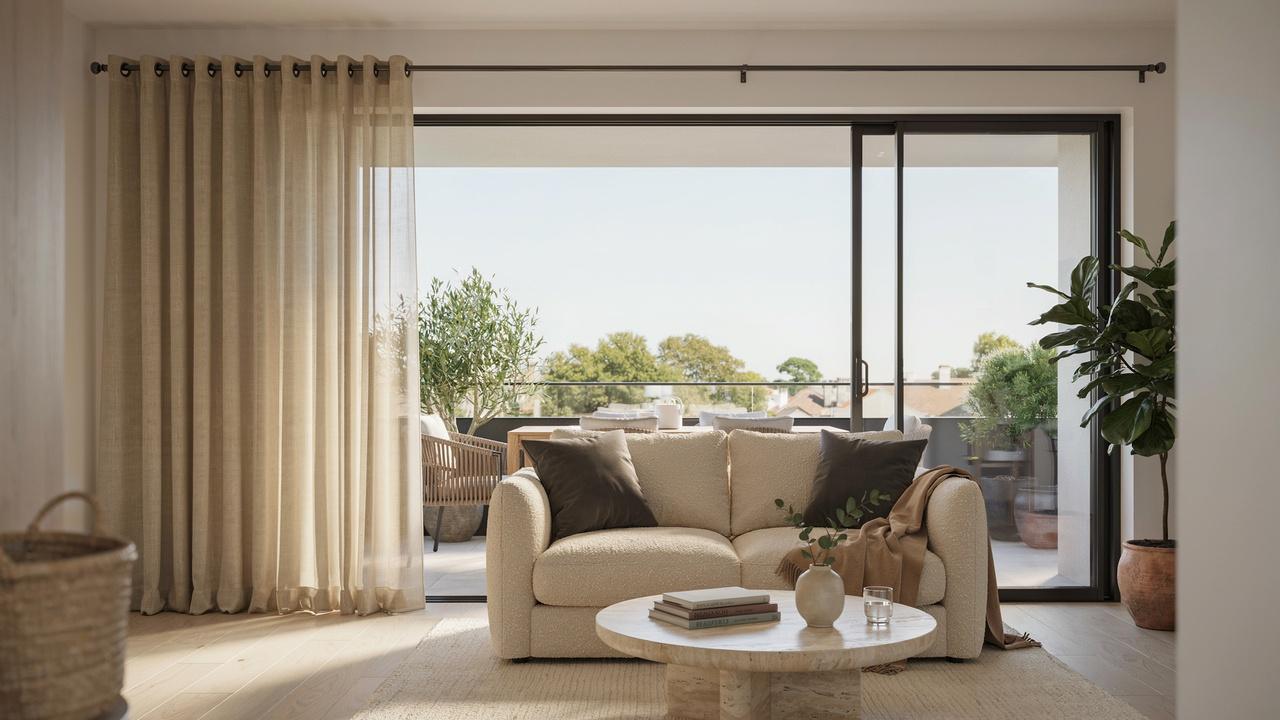 Modern sliding glass doors and balcony area with elegant floor-to-ceiling grommet curtains and abundant natural light.