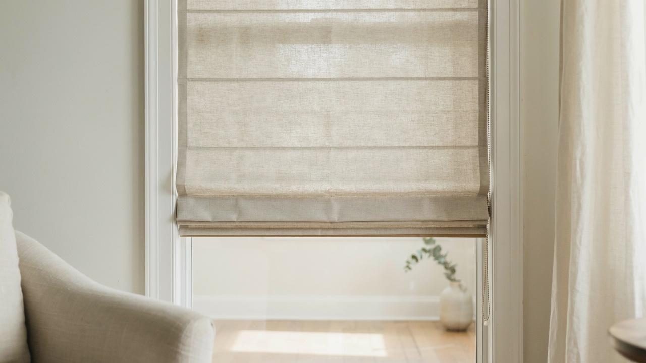 Roman shade installed on a home window.