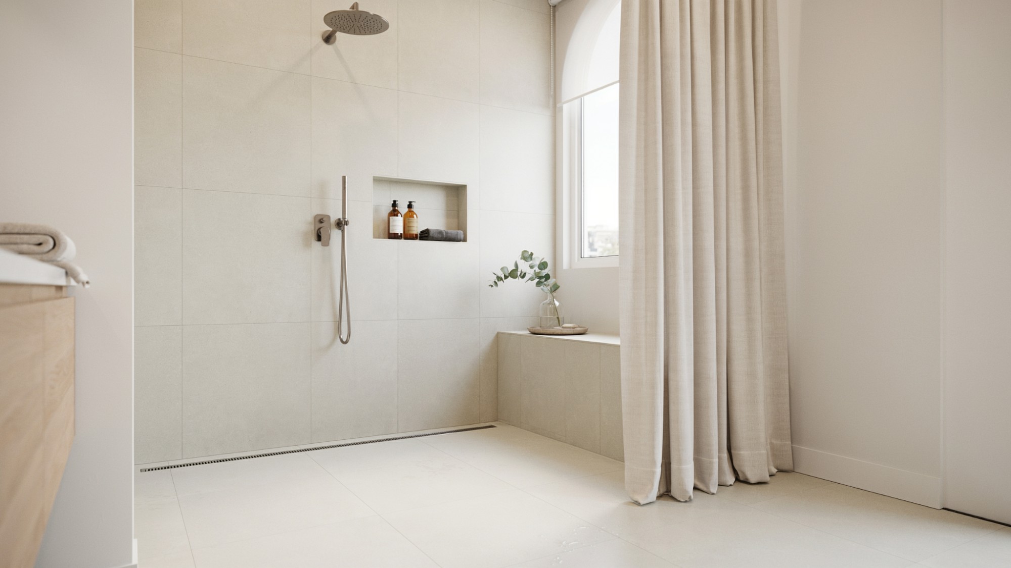 Modern walk-in shower with a seamless floor-to-ceiling curtain that improves room height and privacy.