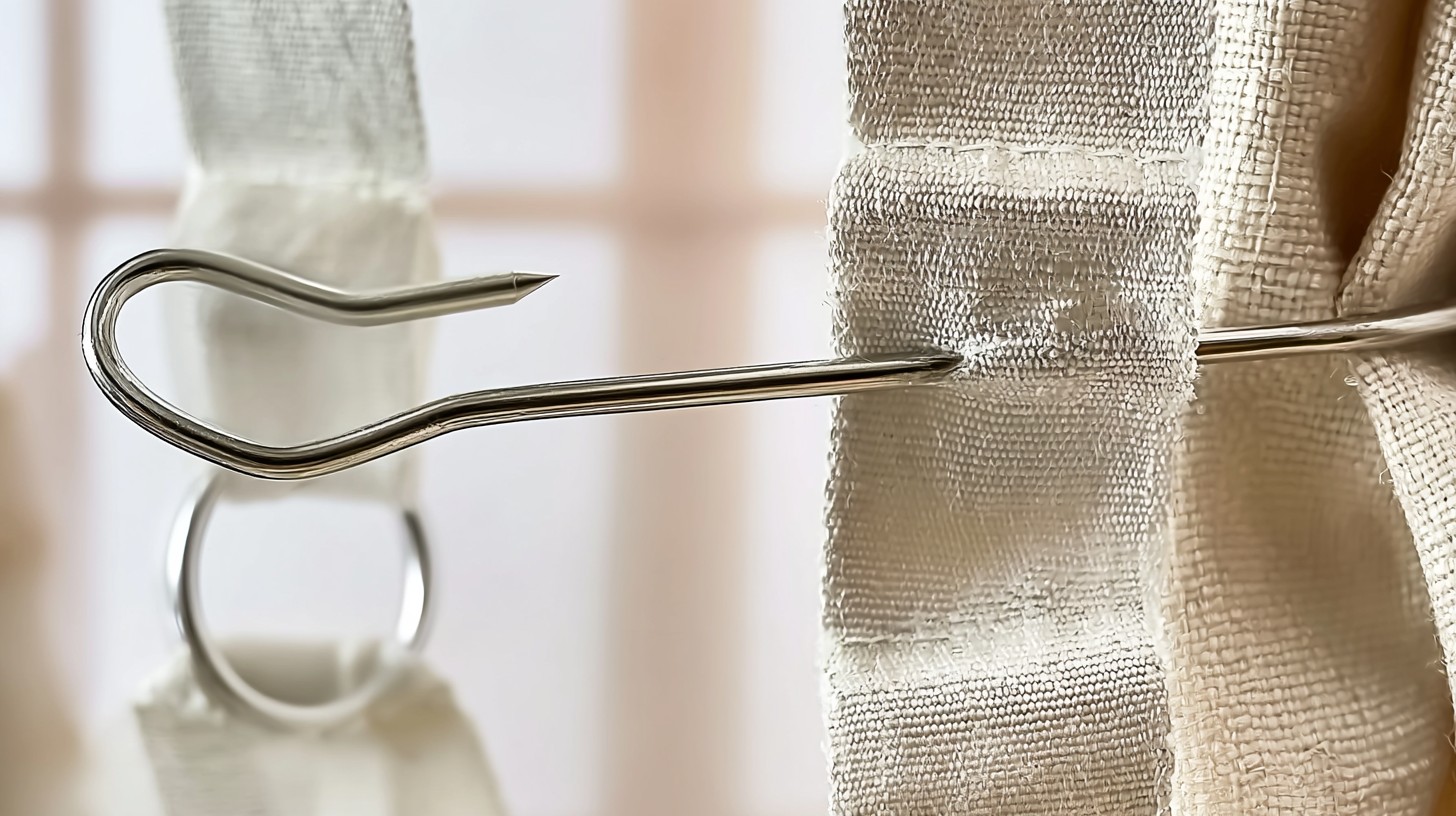 A metal curtain pin hook inserted into pinch pleat heading tape.