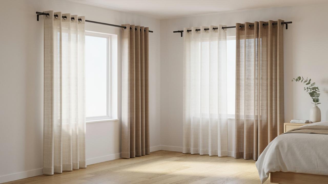 DIY double curtain rod holding sheer and blackout curtain layers.