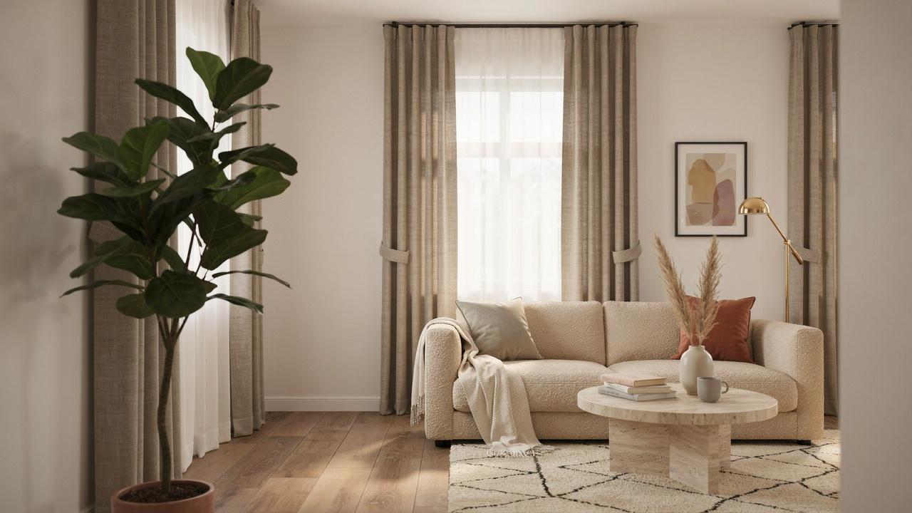 Layered sheer and heavy curtains framing a bright living room window.