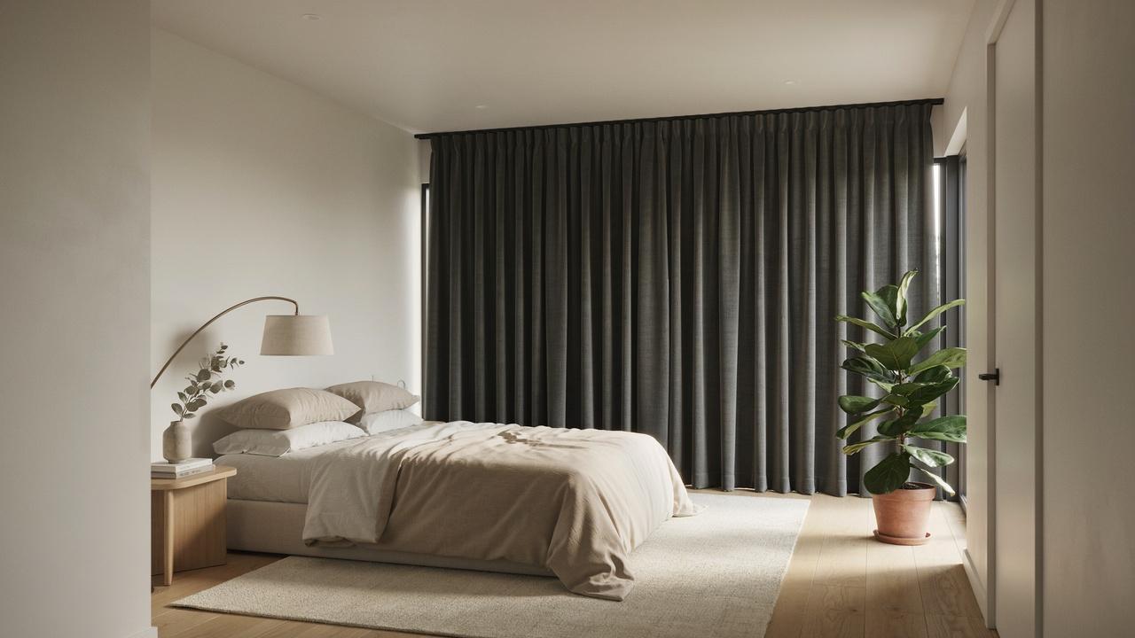 Closed blackout curtains block intense sunlight and help keep a bedroom shaded during a hot day.