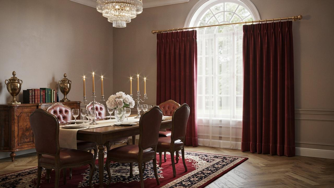 Pinch pleat curtains with structured folds in a formal dining room.