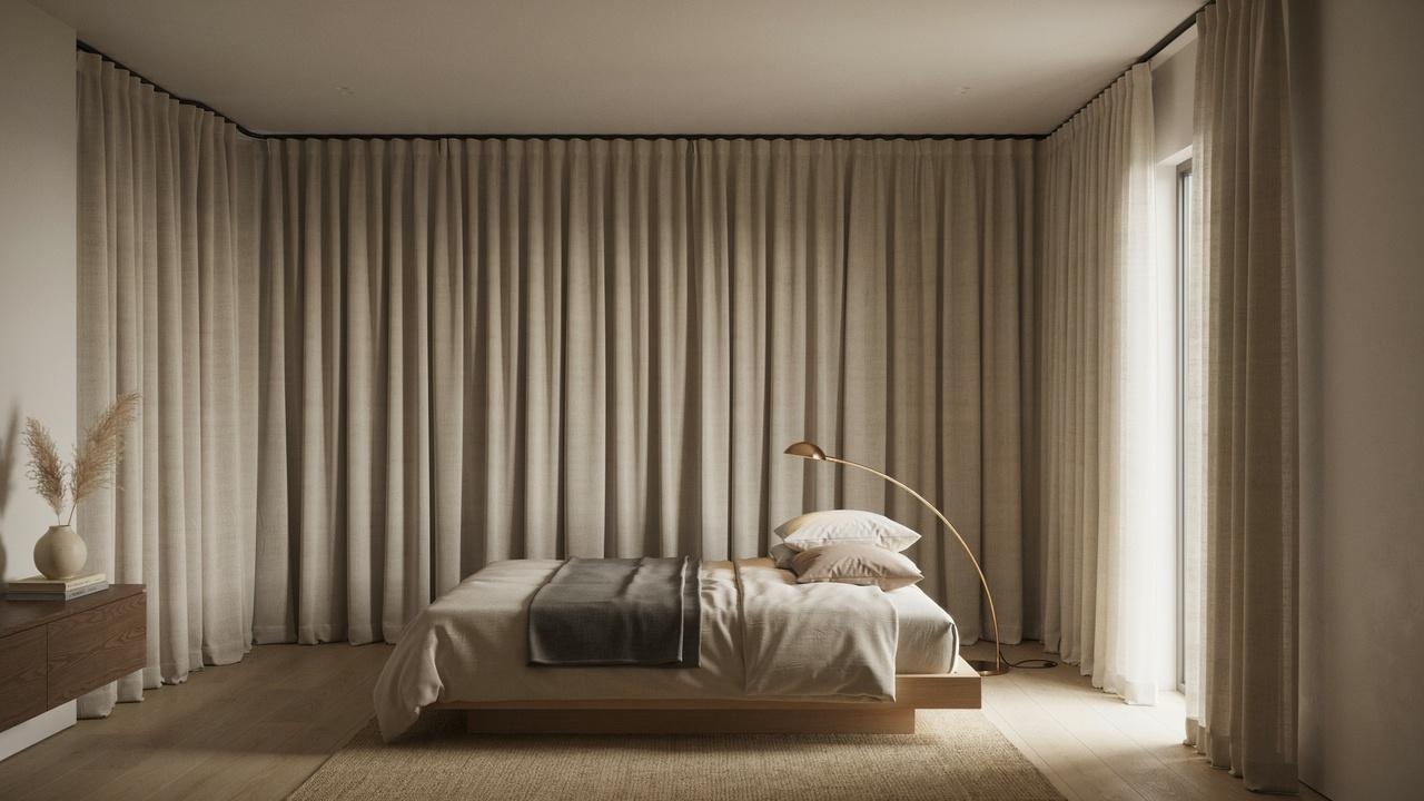 Minimalist bedroom with low wood platform bed, beige linen curtains, brass arc floor lamp, jute rug.