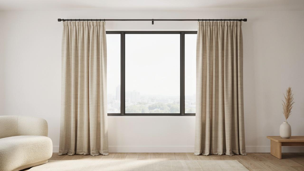 Black curtain rod with ball finials, brackets, screws, brass caliper, tape measure, linen cloth on wood table.