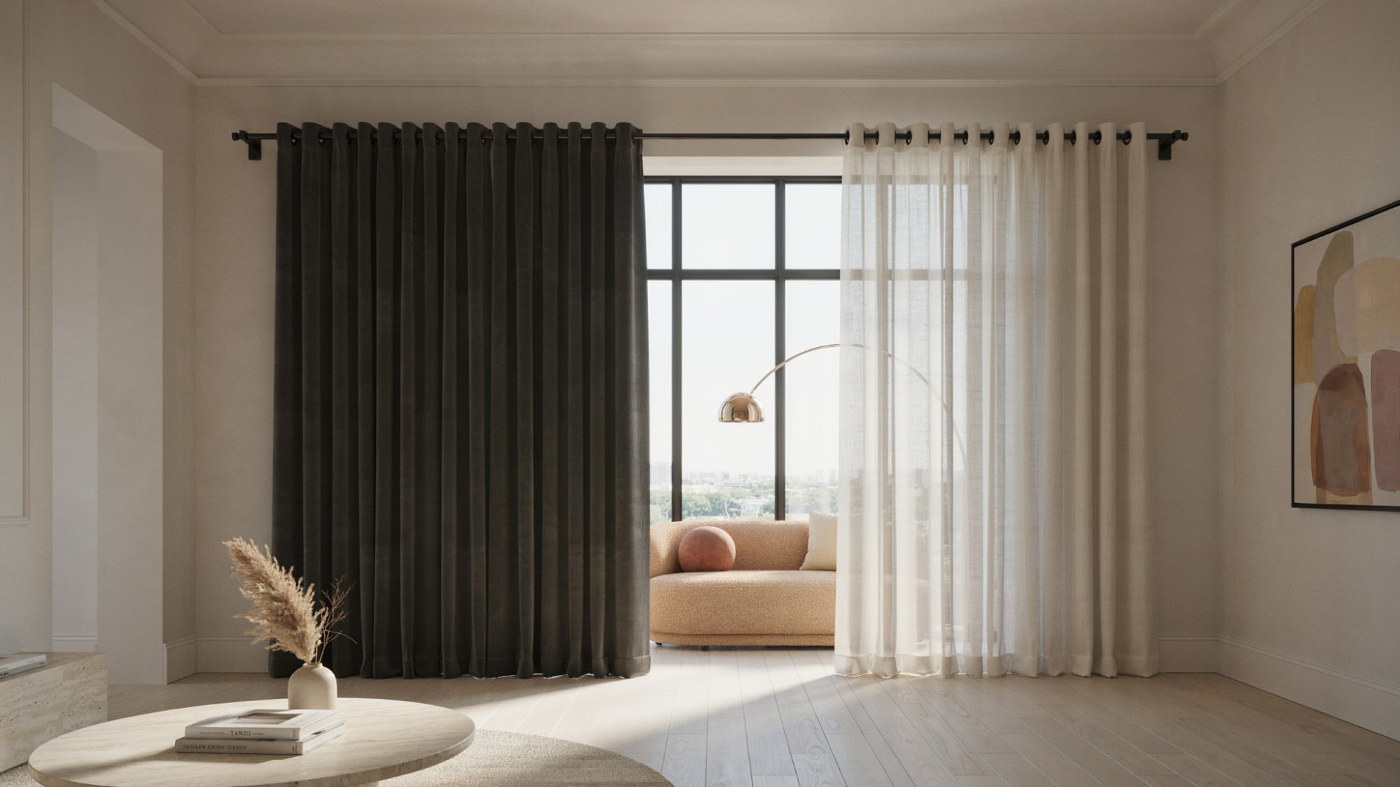 Modern room with dark blackout and sheer white curtains layered on black rod, sofa on balcony, coffee table.